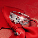 Anel simulado em forma de coração de strass para casal com braços